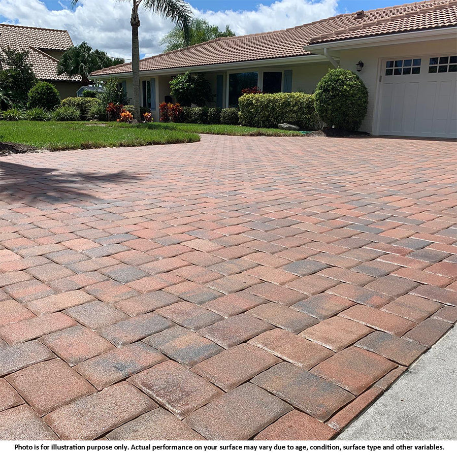 a red paver driveway outside a bungalow house which has been sealed with 2 part urethane cat 5 sealer from trident available from stonesealer Canada