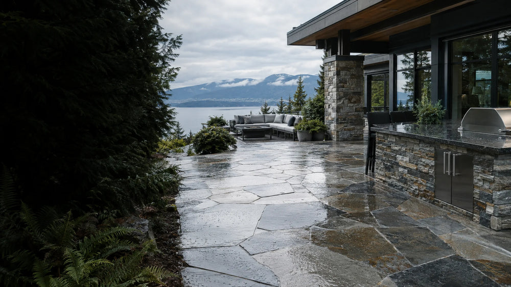 Sealed natural flagstone patio and granite outdoor countertop at a West Coast home on an overcast day